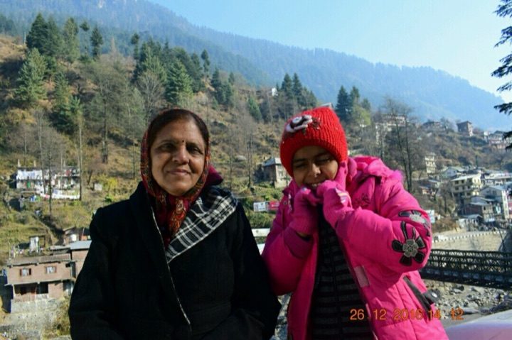 Kalpana with her granddaughter in the mountains