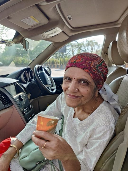 Kalpana with her grandson Rohan, sugarcane juice