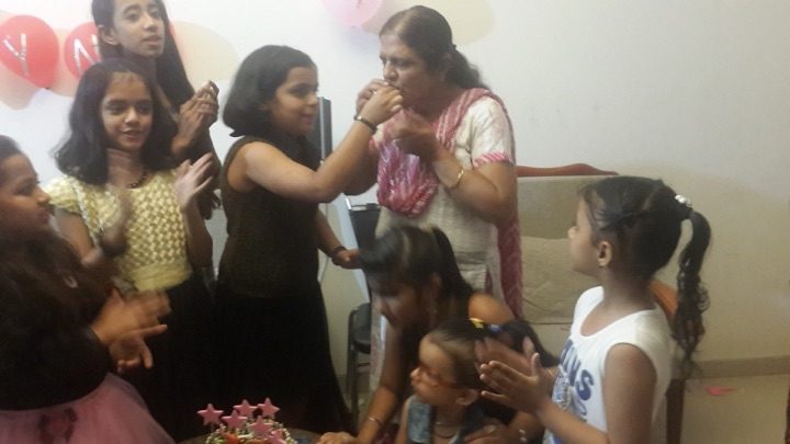 A first bite of cake, given to Kalpana