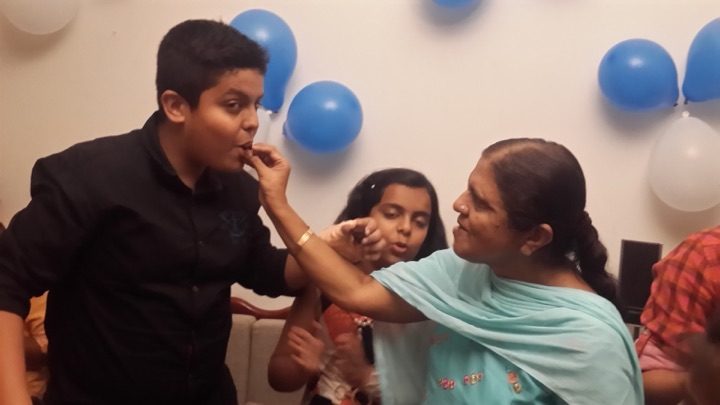A first bite of cake, given to Kalpana