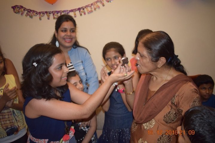 A first bite of cake, given to Kalpana