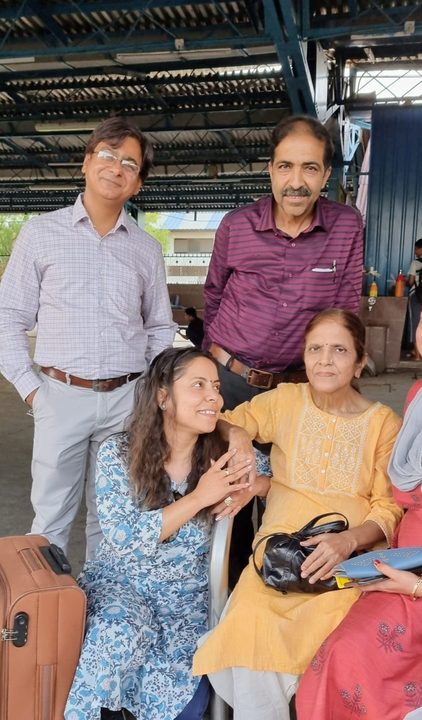 A family photo at a railway station